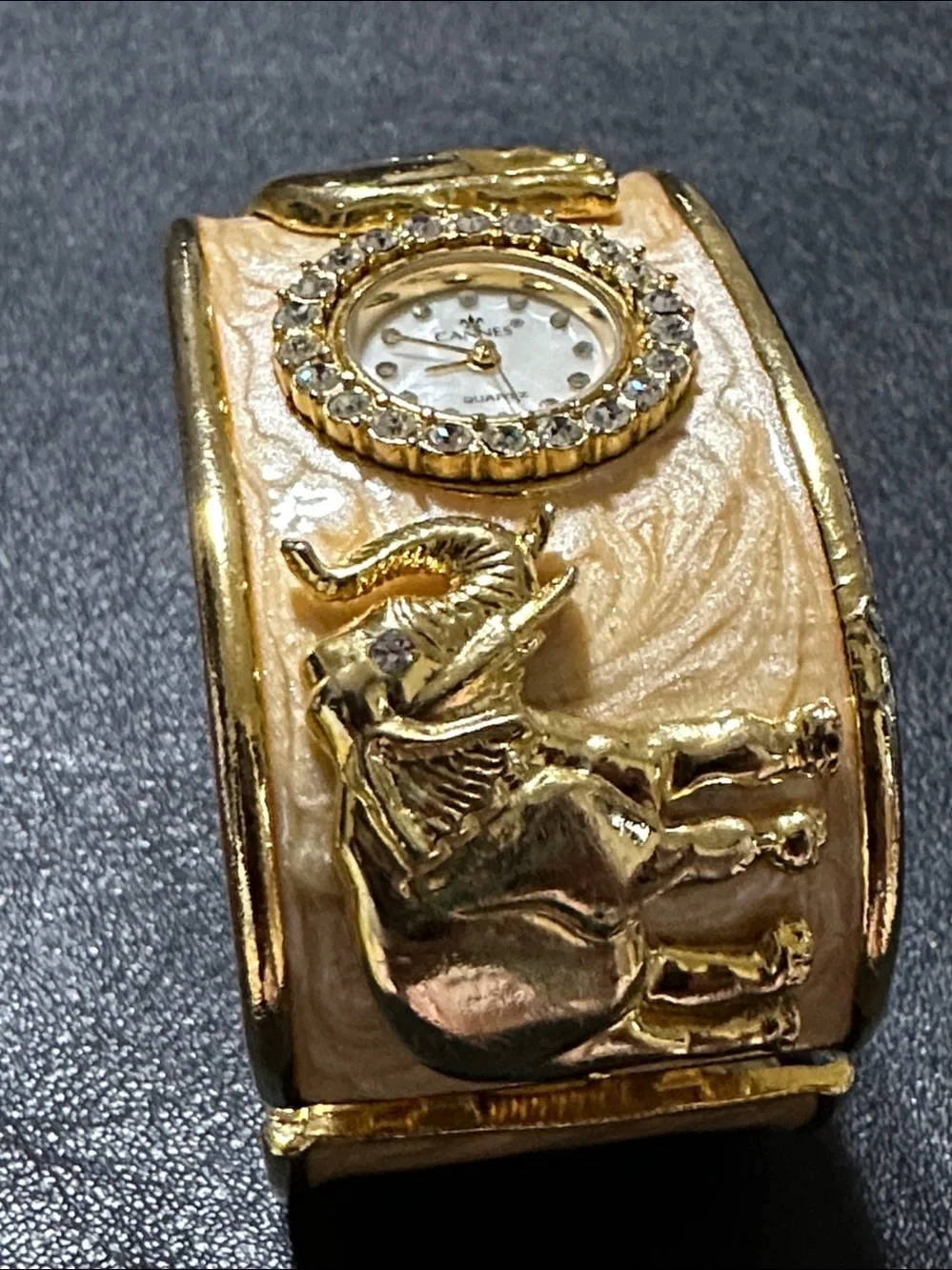 Cannes Gold Tone Elephant Hinged Enamel Clamper Bracelet Watch
